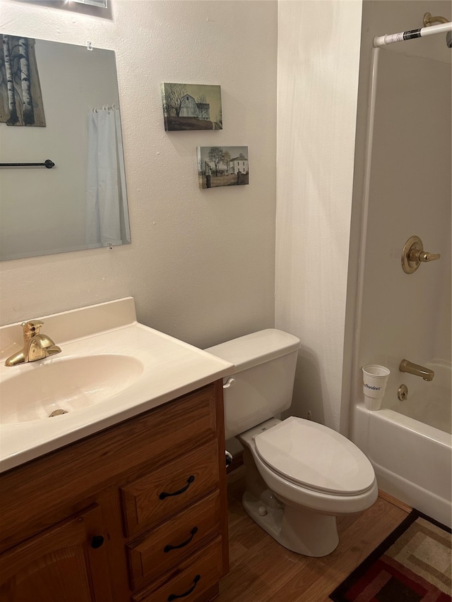 full bathroom featuring vanity, toilet, wood-type flooring, and shower / bath combination with curtain