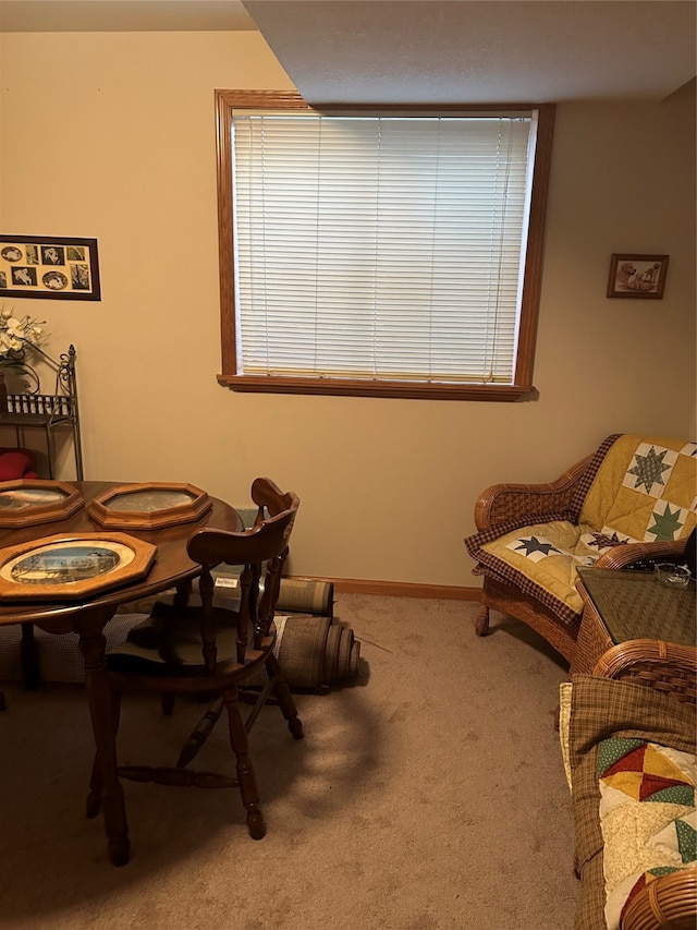 view of carpeted dining area