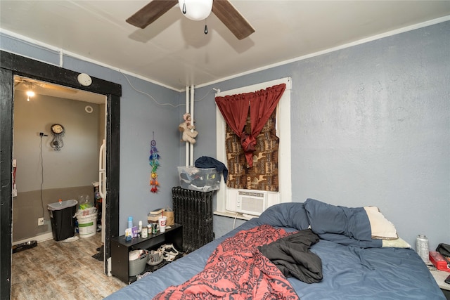 bedroom featuring ceiling fan and cooling unit