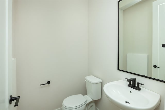 bathroom with sink and toilet