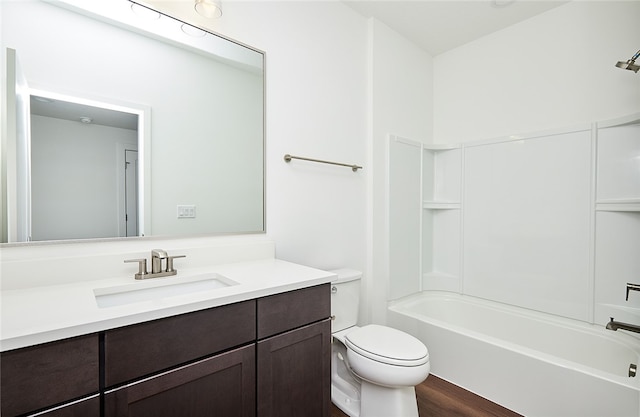 full bathroom with shower / tub combination, toilet, vanity, and wood-type flooring