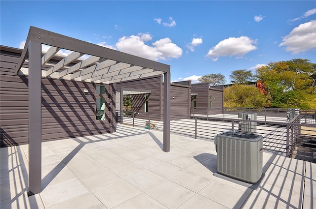 view of patio / terrace featuring central AC and a pergola