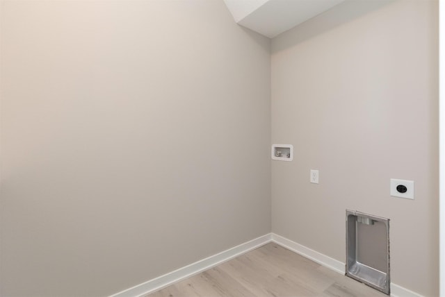 laundry room featuring electric dryer hookup, washer hookup, and light hardwood / wood-style flooring