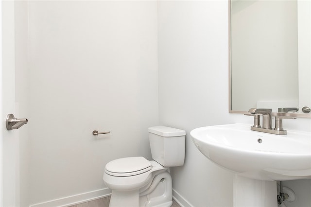 bathroom with sink and toilet