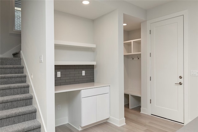 staircase featuring hardwood / wood-style flooring