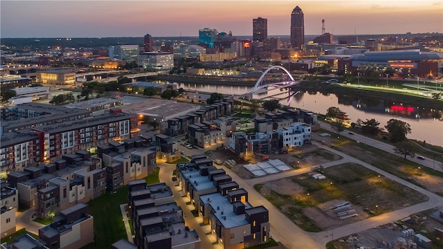 aerial view at dusk with a water view