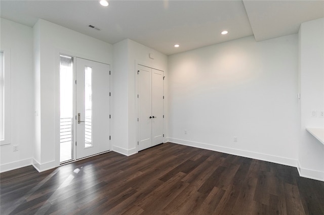 foyer entrance with dark hardwood / wood-style flooring