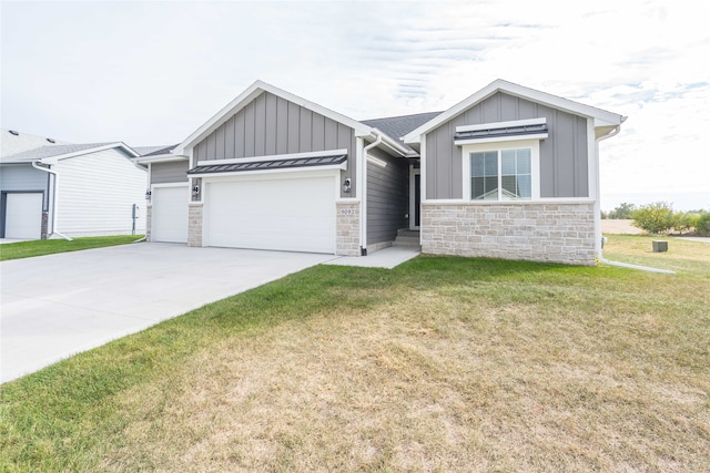 view of front of property with a garage and a front lawn