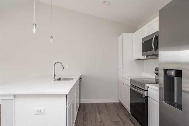 kitchen featuring white cabinets, stainless steel appliances, sink, and lofted ceiling