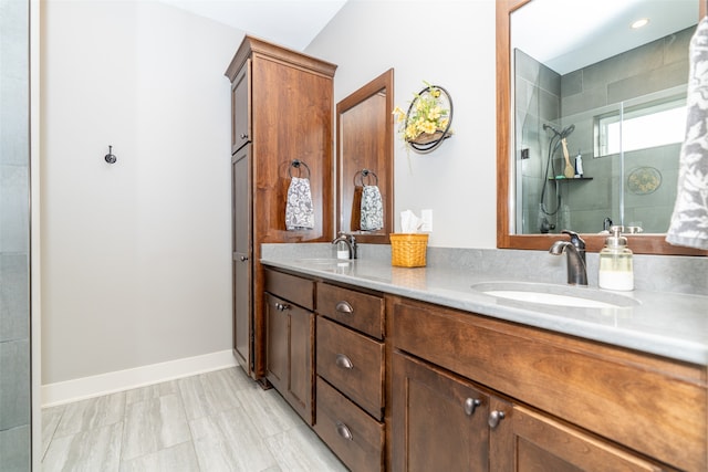 bathroom featuring vanity and a shower with door