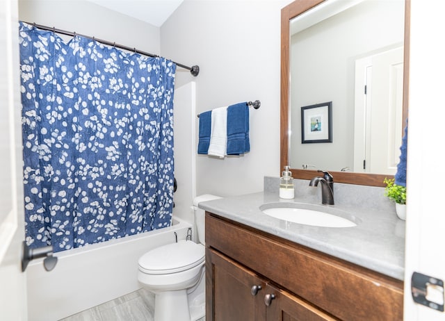 full bathroom with shower / bath combination with curtain, vanity, and toilet