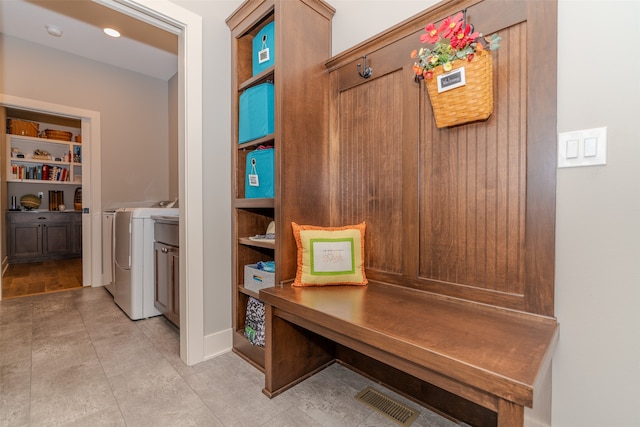 mudroom with washing machine and clothes dryer