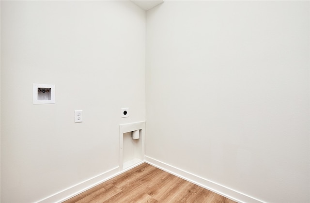 laundry room with washer hookup, light wood-type flooring, and electric dryer hookup