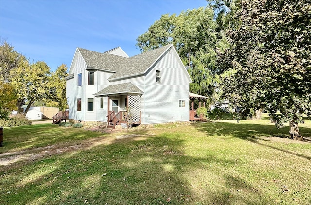 view of side of property featuring a yard