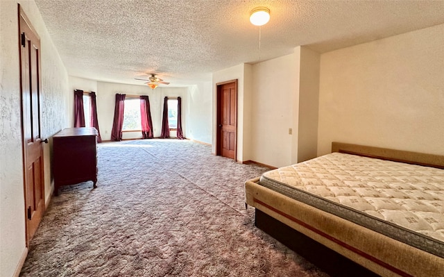 carpeted bedroom with ceiling fan and a textured ceiling