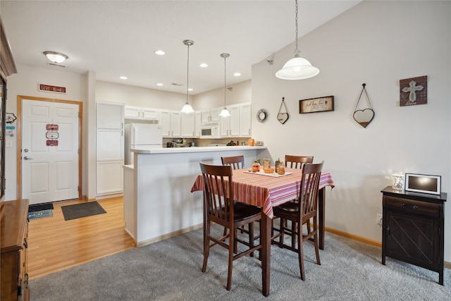 dining space with light wood-type flooring