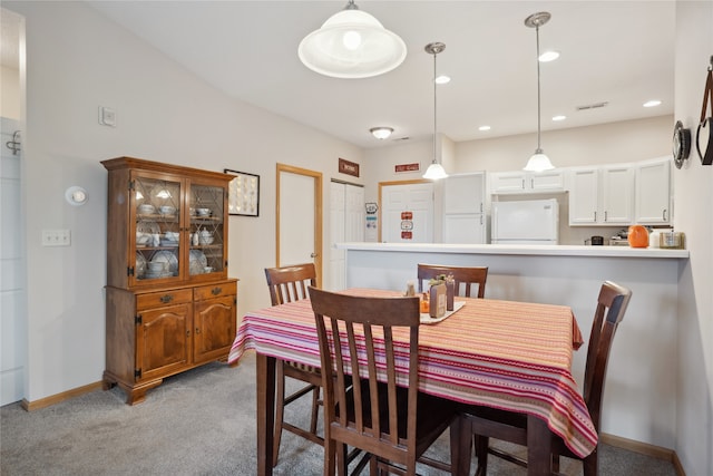 dining room featuring light colored carpet