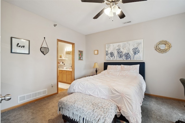 carpeted bedroom with connected bathroom and ceiling fan