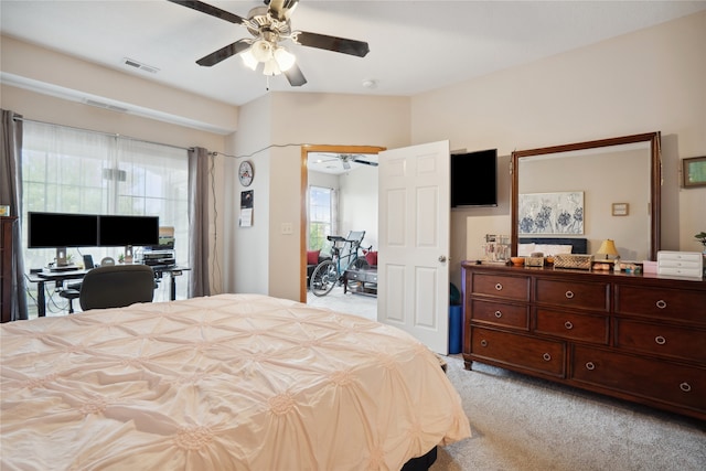 bedroom featuring ceiling fan and light colored carpet