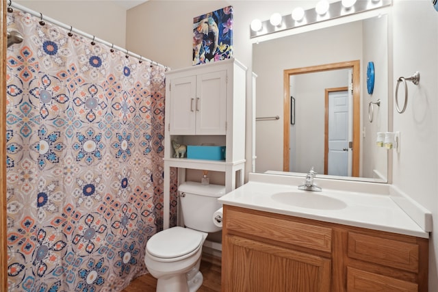 bathroom featuring vanity, toilet, and wood-type flooring