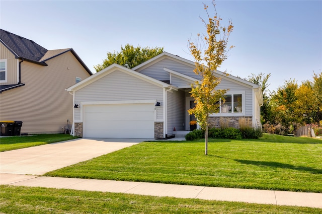 view of front of home with a front yard and a garage