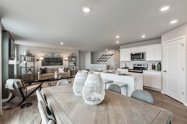 dining area with hardwood / wood-style flooring