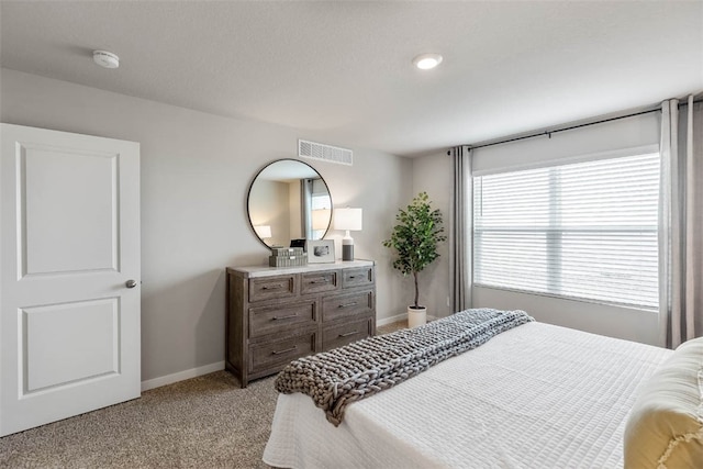 bedroom featuring light carpet