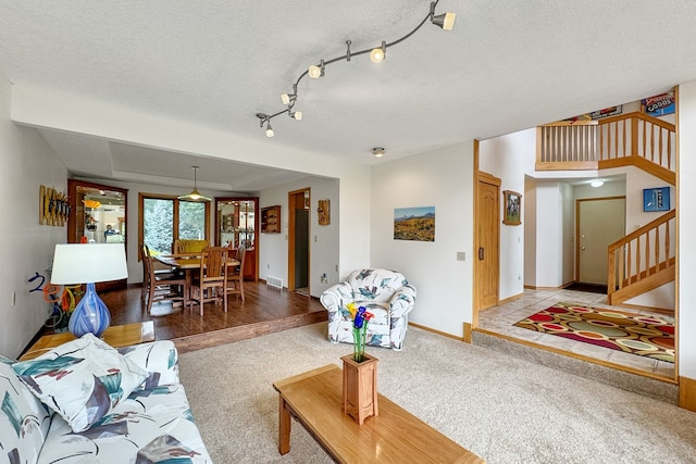 living room featuring hardwood / wood-style floors and a textured ceiling