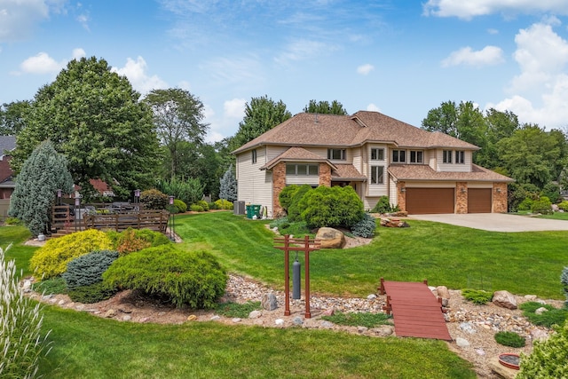 view of front facade with a garage and a front lawn