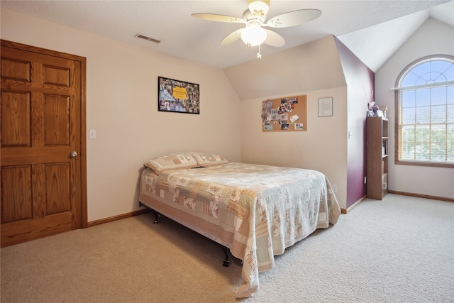 bedroom featuring lofted ceiling, ceiling fan, and carpet