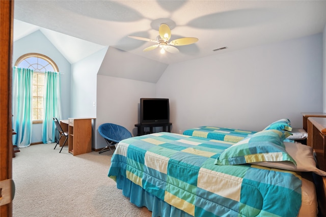 carpeted bedroom featuring ceiling fan and vaulted ceiling