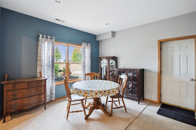 view of carpeted dining space