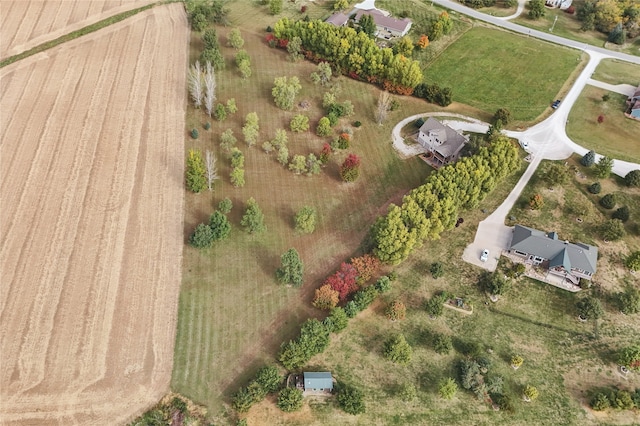 birds eye view of property with a rural view