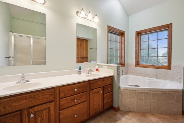 bathroom with tile patterned flooring, plus walk in shower, lofted ceiling, and vanity