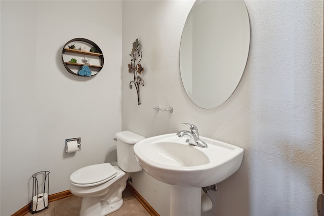 bathroom with tile patterned floors and toilet