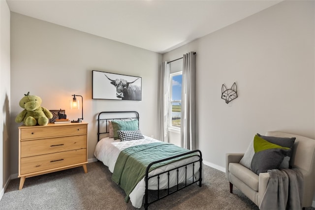 bedroom featuring dark colored carpet