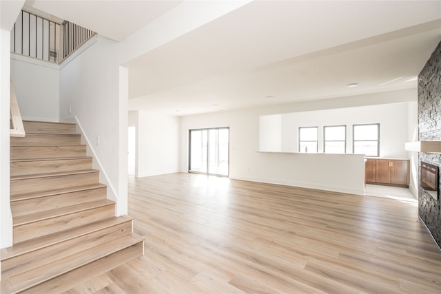 interior space featuring a fireplace and wood-type flooring