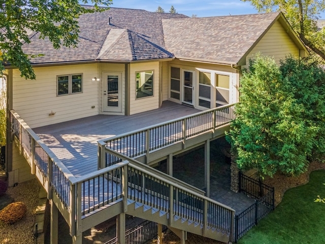 back of house with a wooden deck