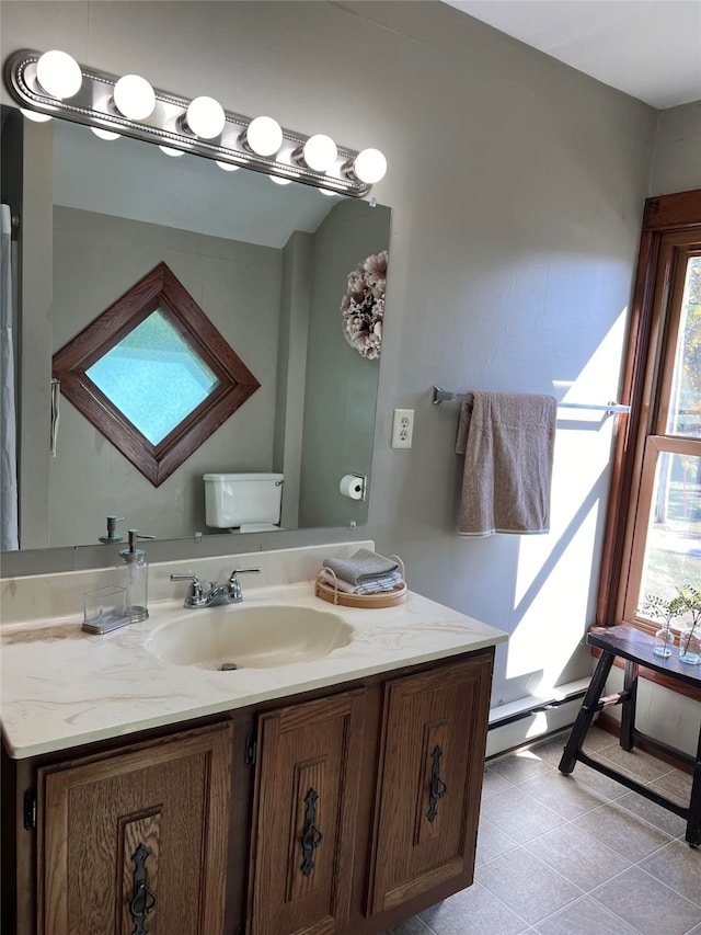 bathroom featuring toilet and vanity