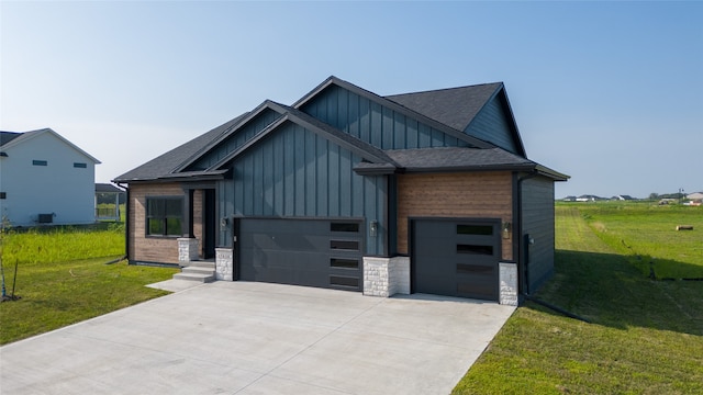 view of front of house with a front yard and a garage