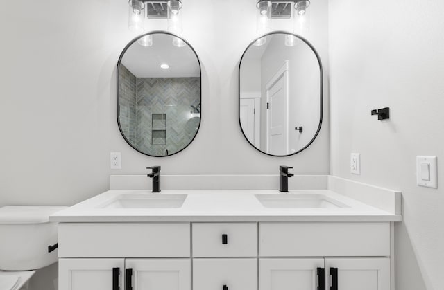 bathroom featuring vanity and a shower