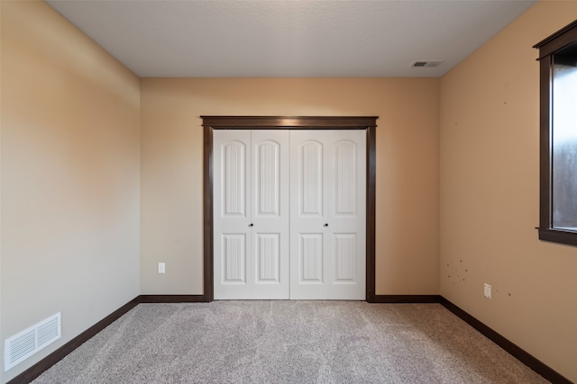 unfurnished bedroom featuring carpet