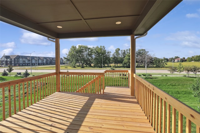 wooden terrace with a yard