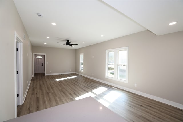 spare room with hardwood / wood-style flooring and ceiling fan