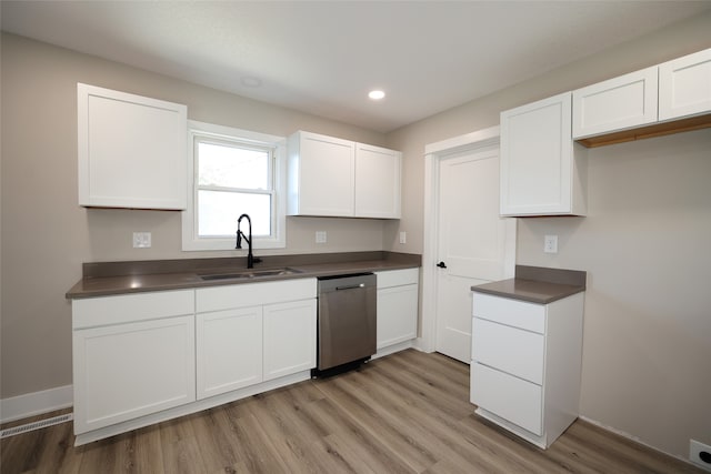 kitchen with white cabinetry, light wood-type flooring, sink, and stainless steel dishwasher