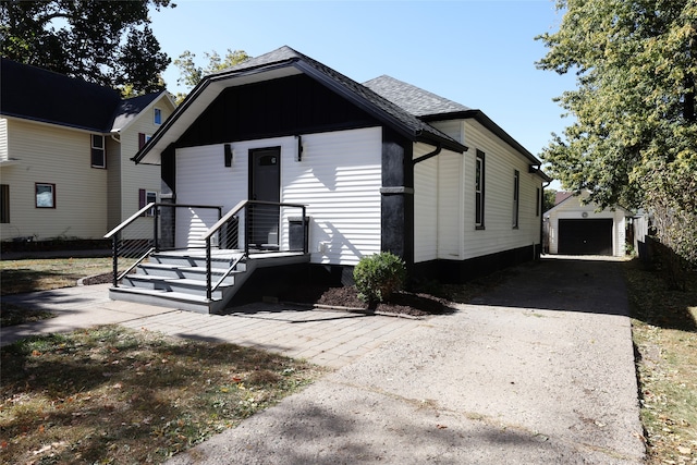 view of front of house featuring an outbuilding and a garage