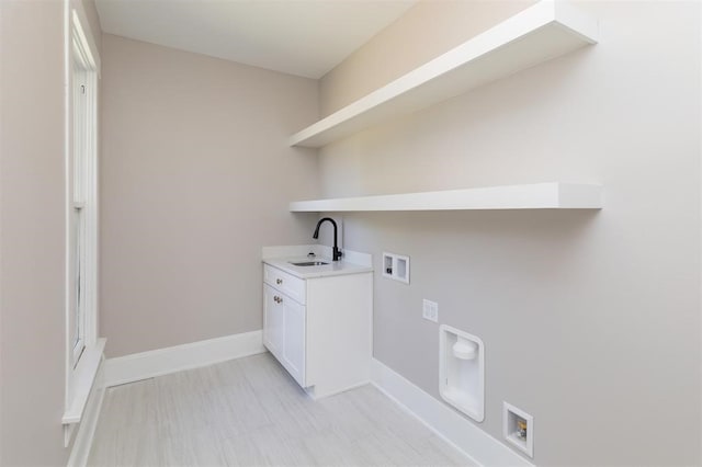 laundry area with washer hookup, a sink, baseboards, cabinet space, and electric dryer hookup