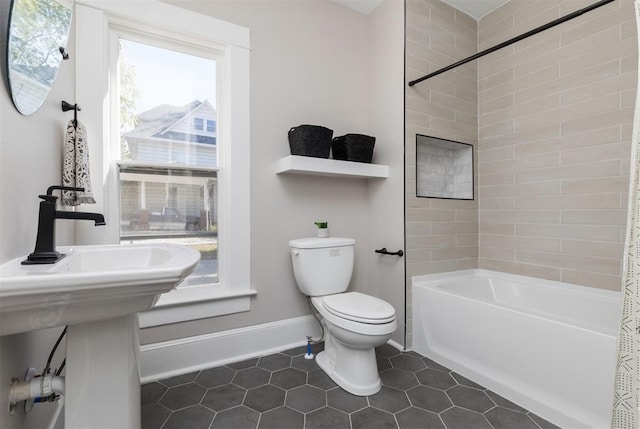 full bath with  shower combination, tile patterned flooring, baseboards, and toilet