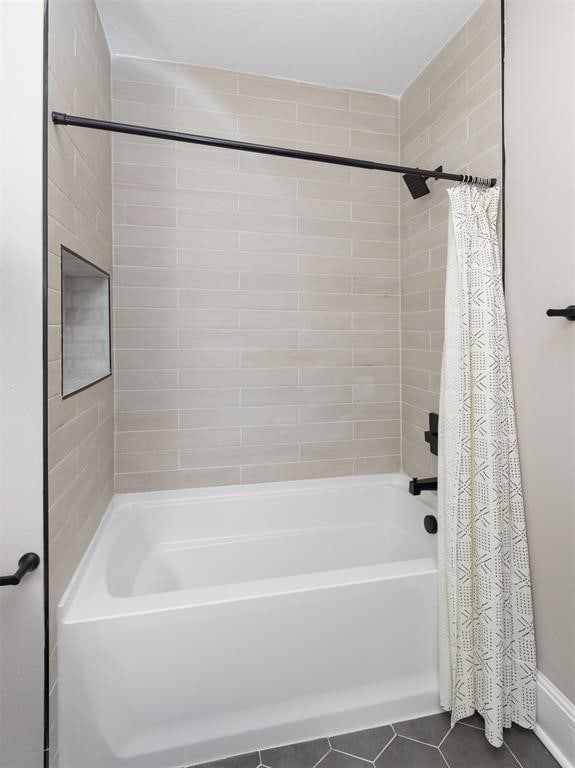 bathroom with tile patterned flooring and shower / bathtub combination with curtain