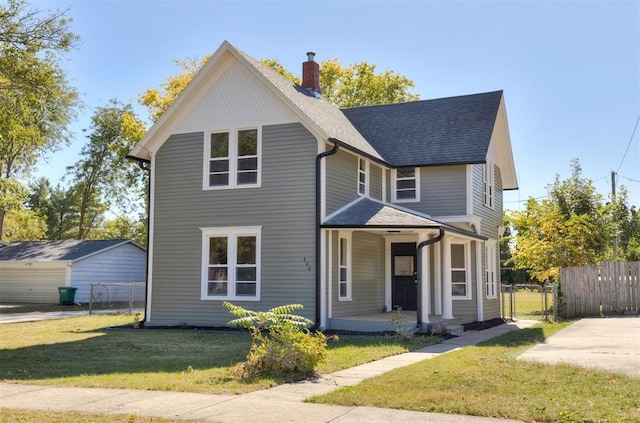 view of front of house with a shingled roof, a chimney, covered porch, fence, and a front yard